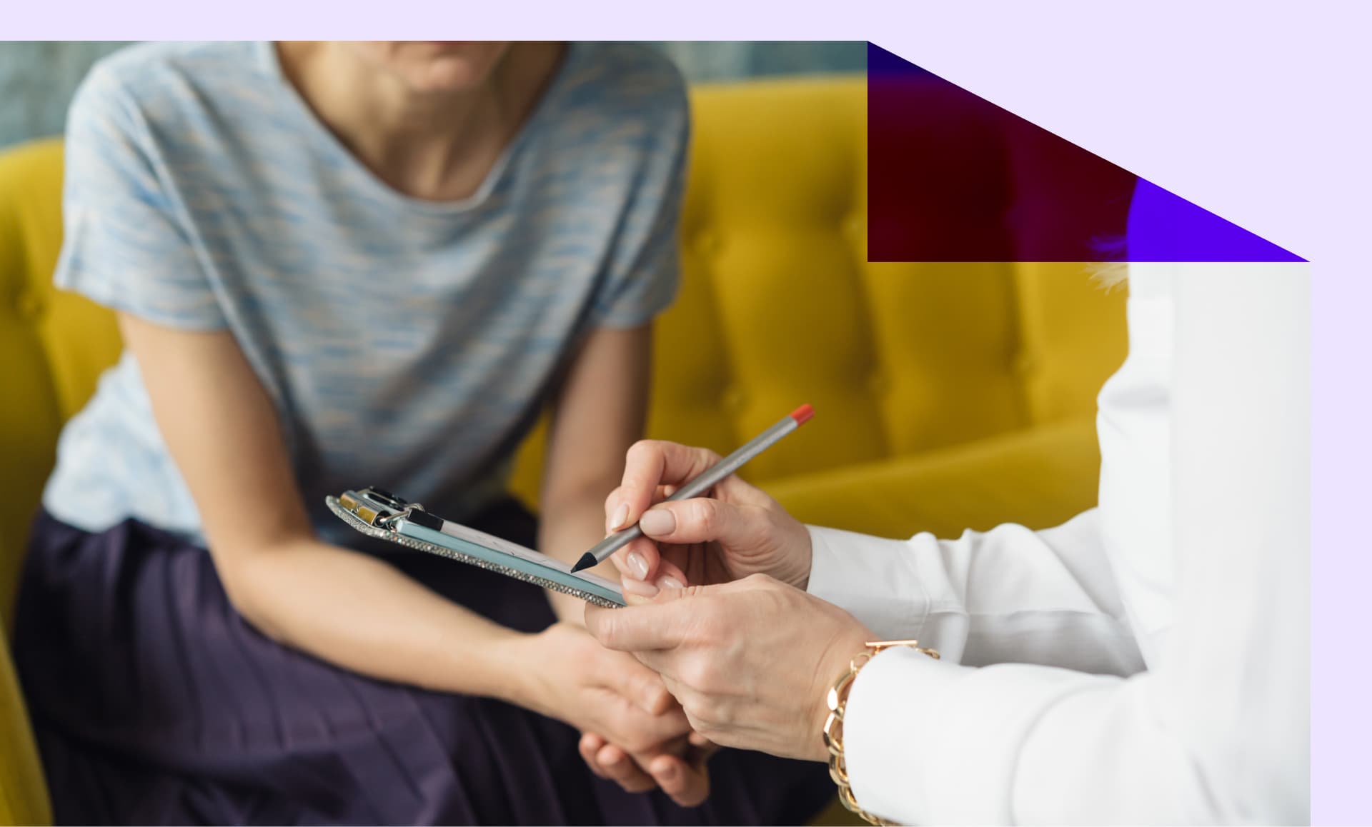 Doctor taking notes with a patient