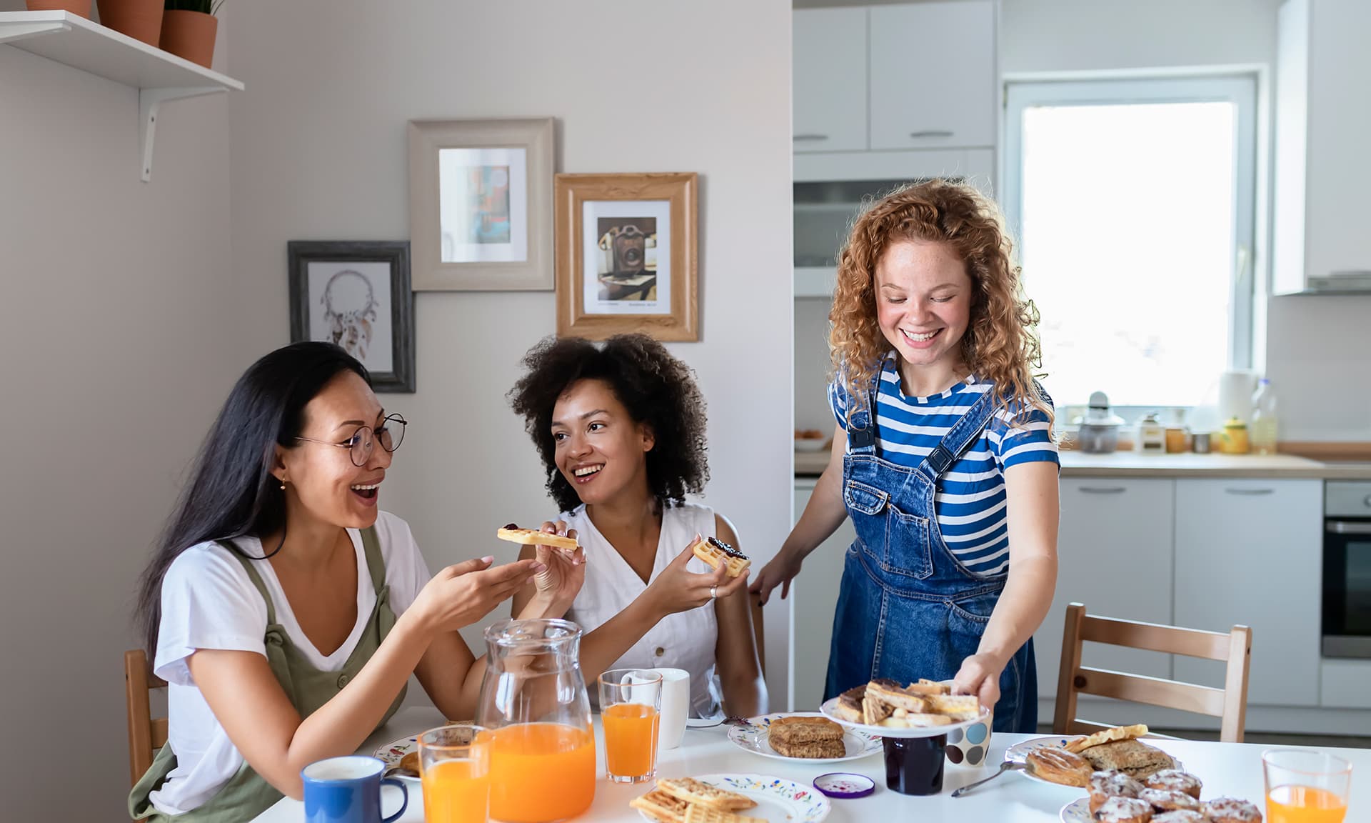 Three friends eating breakfast together
