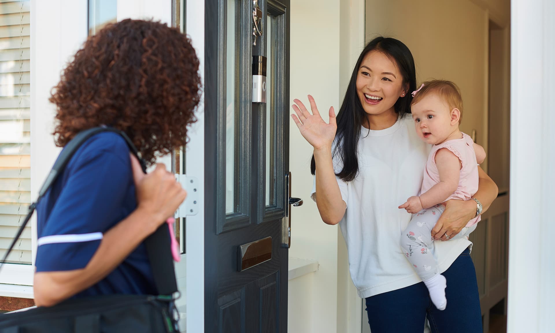 babysitter waving at mom goodbye