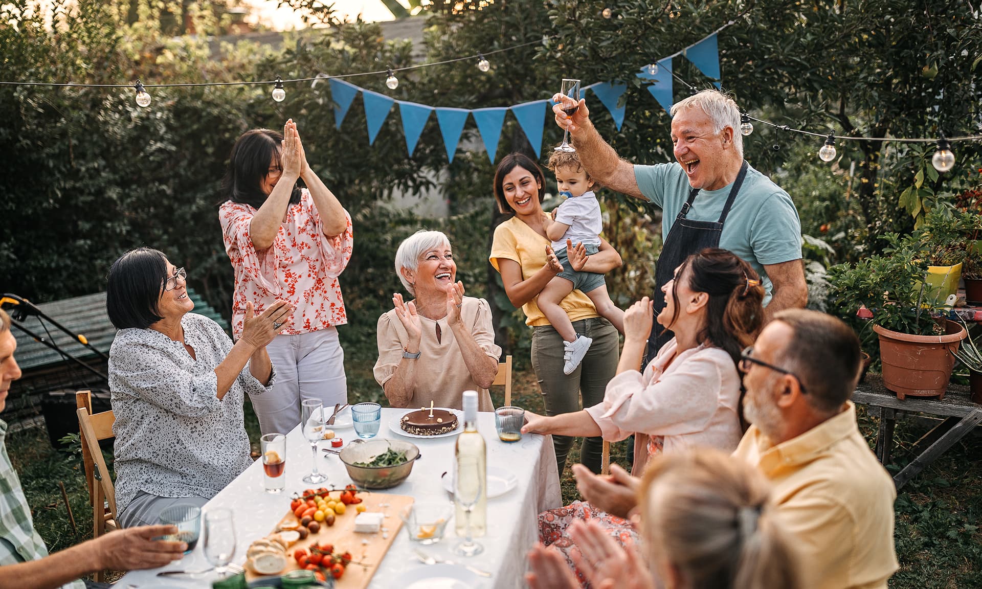 Family birthday celebration outdoors